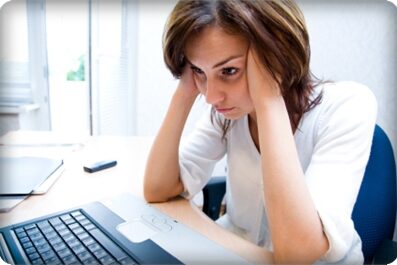 Woman thinks to notebook
